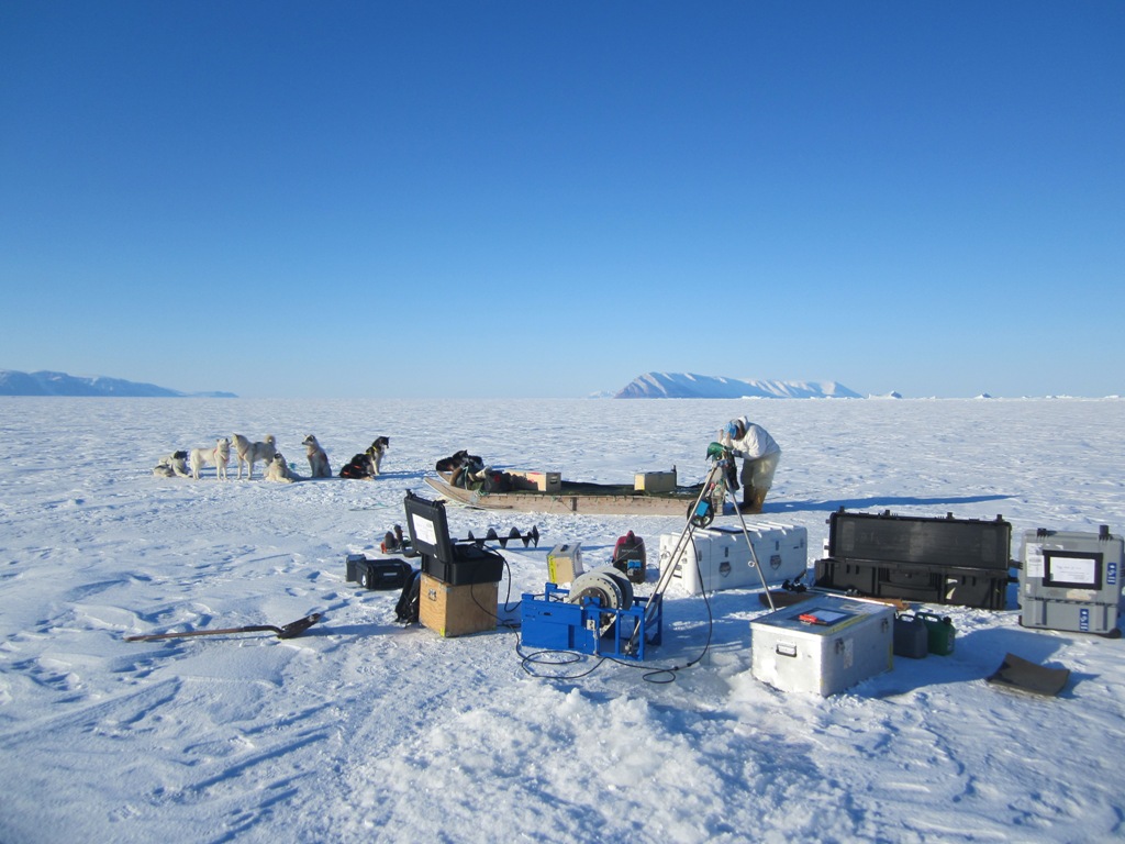 DMI researcher Steffan Olsen working on ice with Inuit hunters for observing ocean and sea-ice in the Arctic